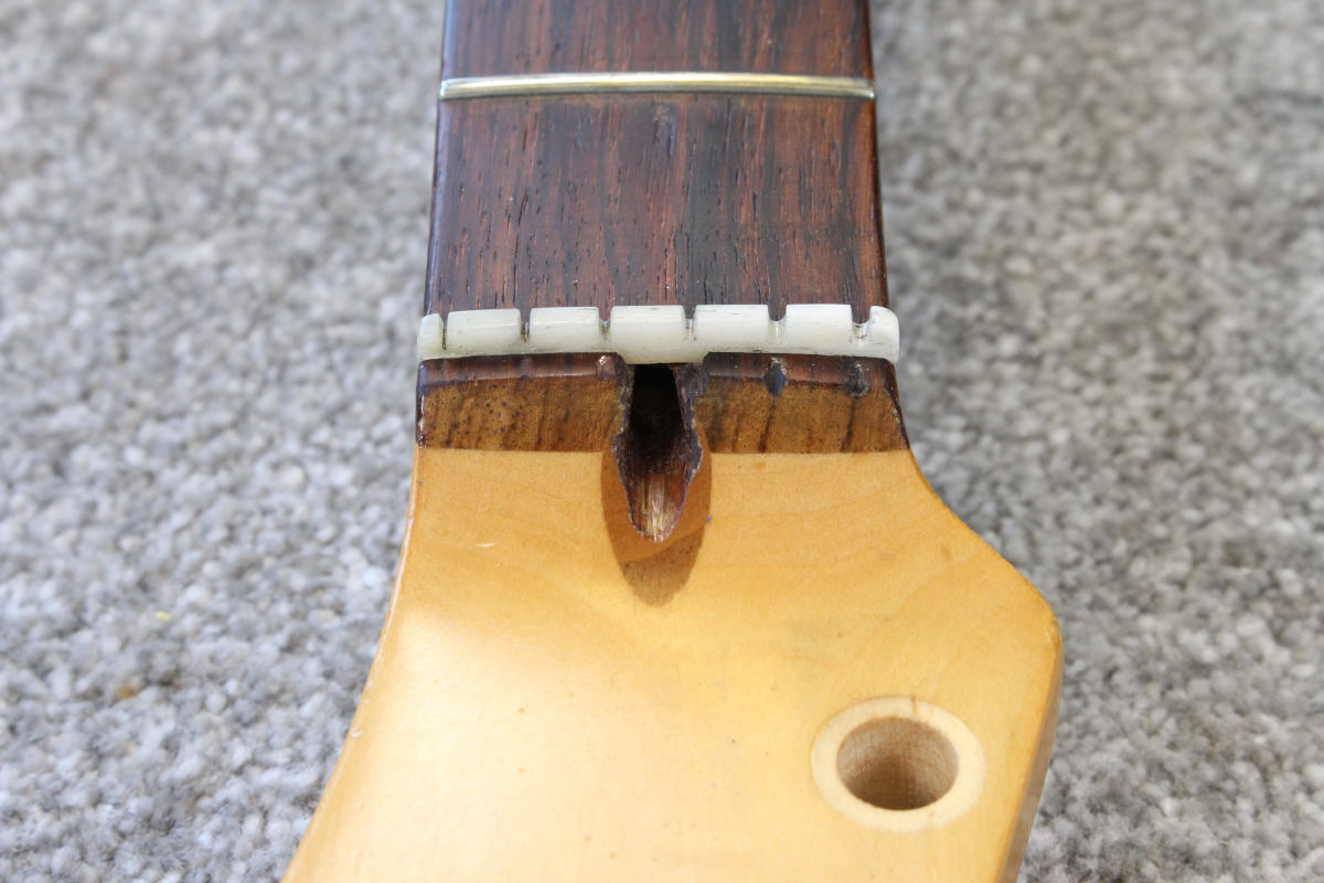 Removing a damaged Fender truss rod nut Flame Guitars